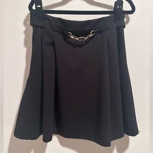 Black skirt with front gold belt chain accent